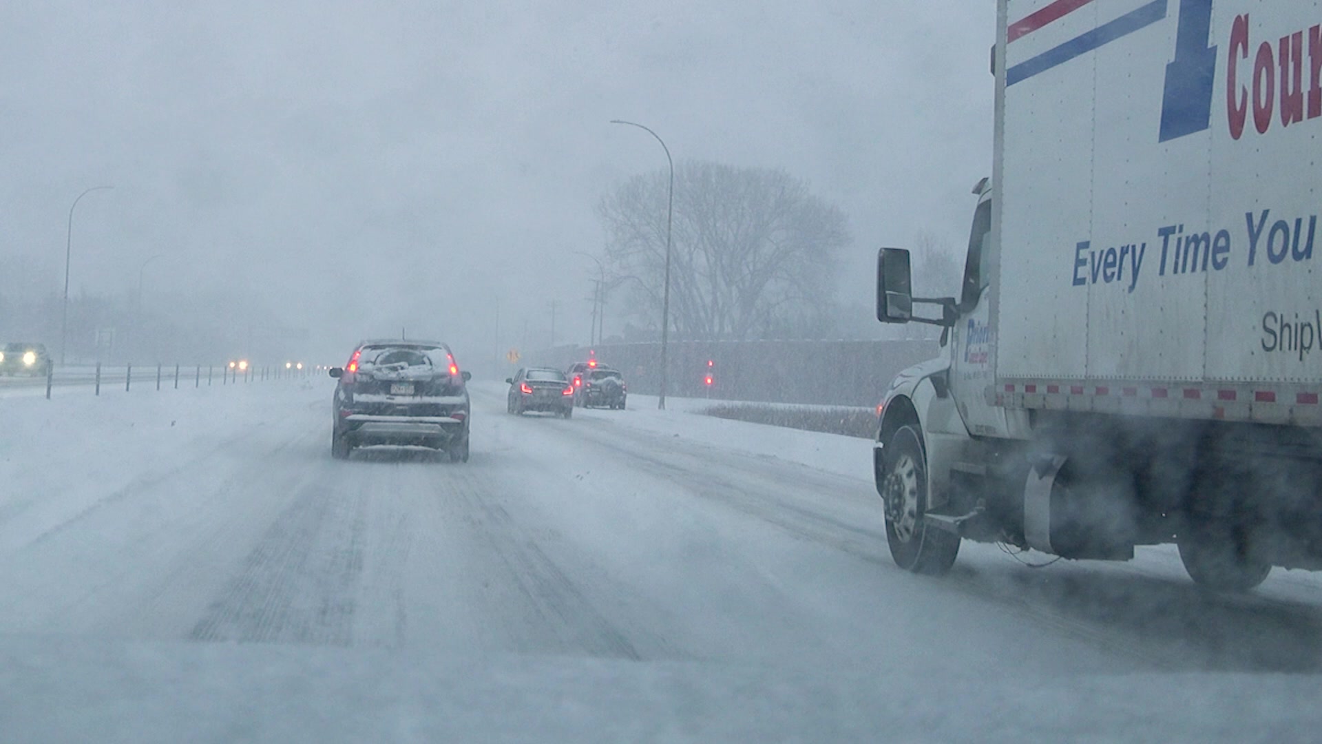Minneapolis, MN Winter Storm at Rush Hour, Cars in Ditch, And Heavy Snow